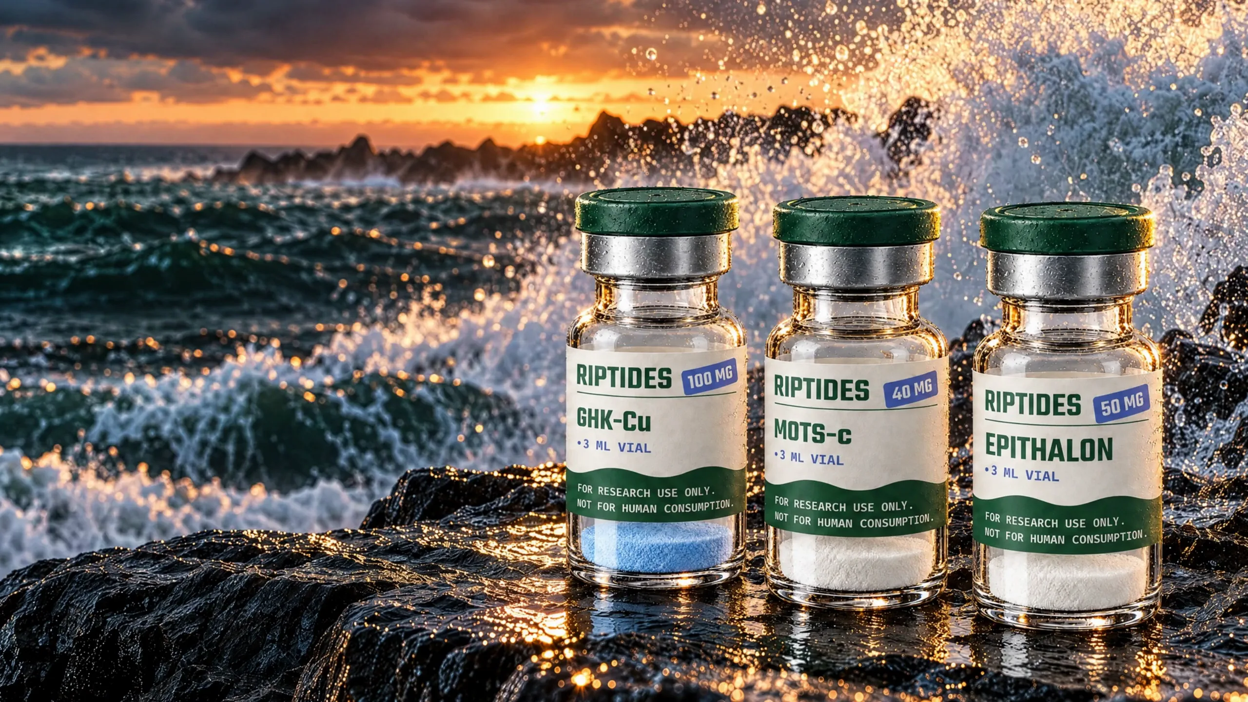 Three Riptides vials on wet black basalt as dusk waves break behind them